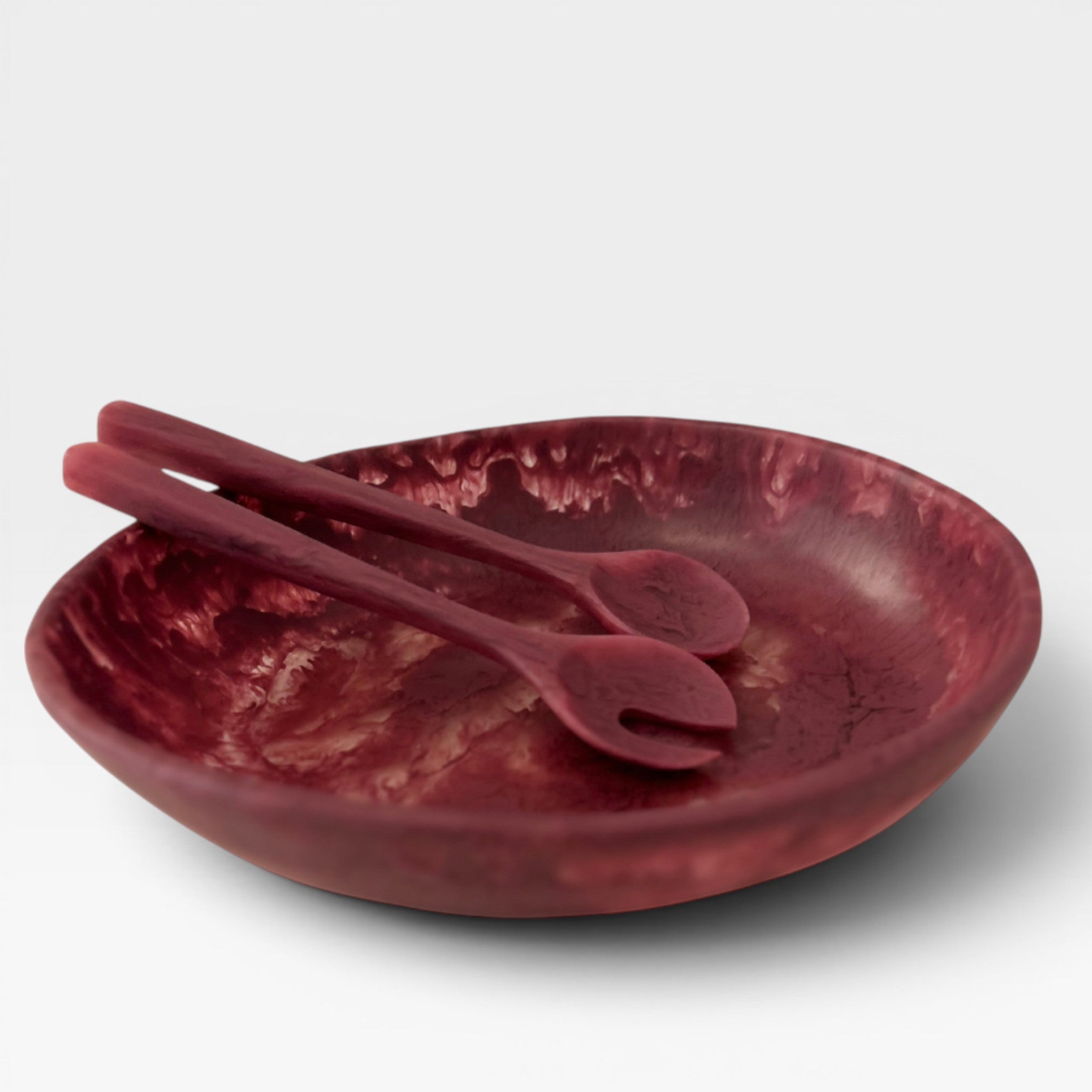 Keep-collections burnt fuschia salad bowl with matching serving spoons. Swirled resin material.