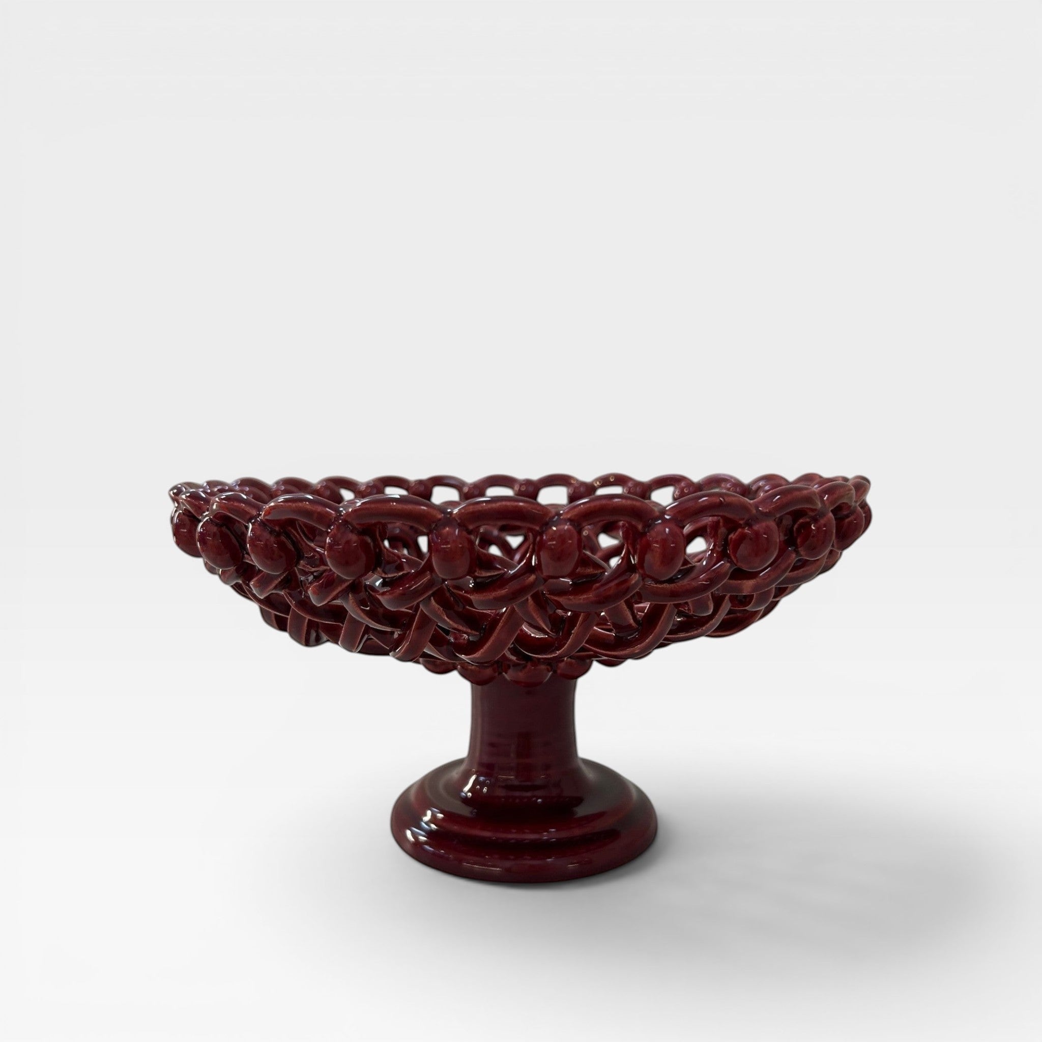 keep-collections deep red ceramic pedestal fruit bowl with intricate woven detailing