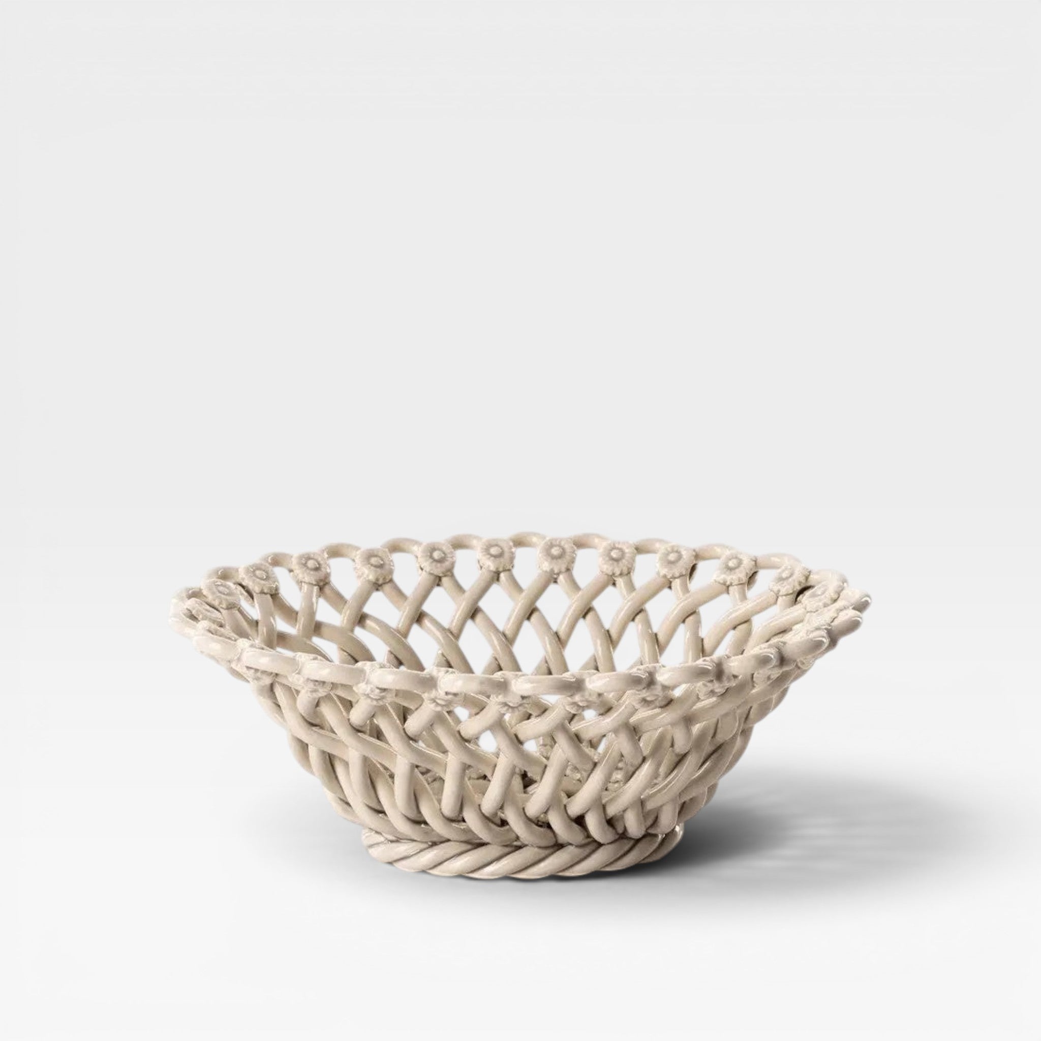 Keep-collections creamy woven floral ceramic fruit bowl with intricate basket weave design.