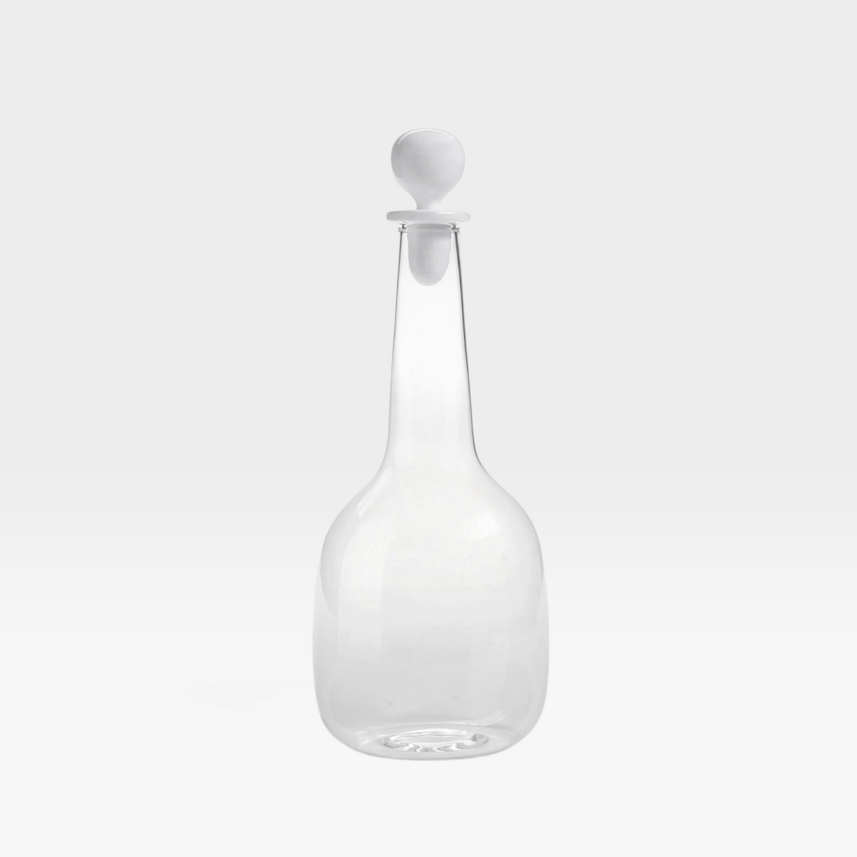 keep-collections clear glass decanter with a slender neck and a sleek white spherical stopper on a white background