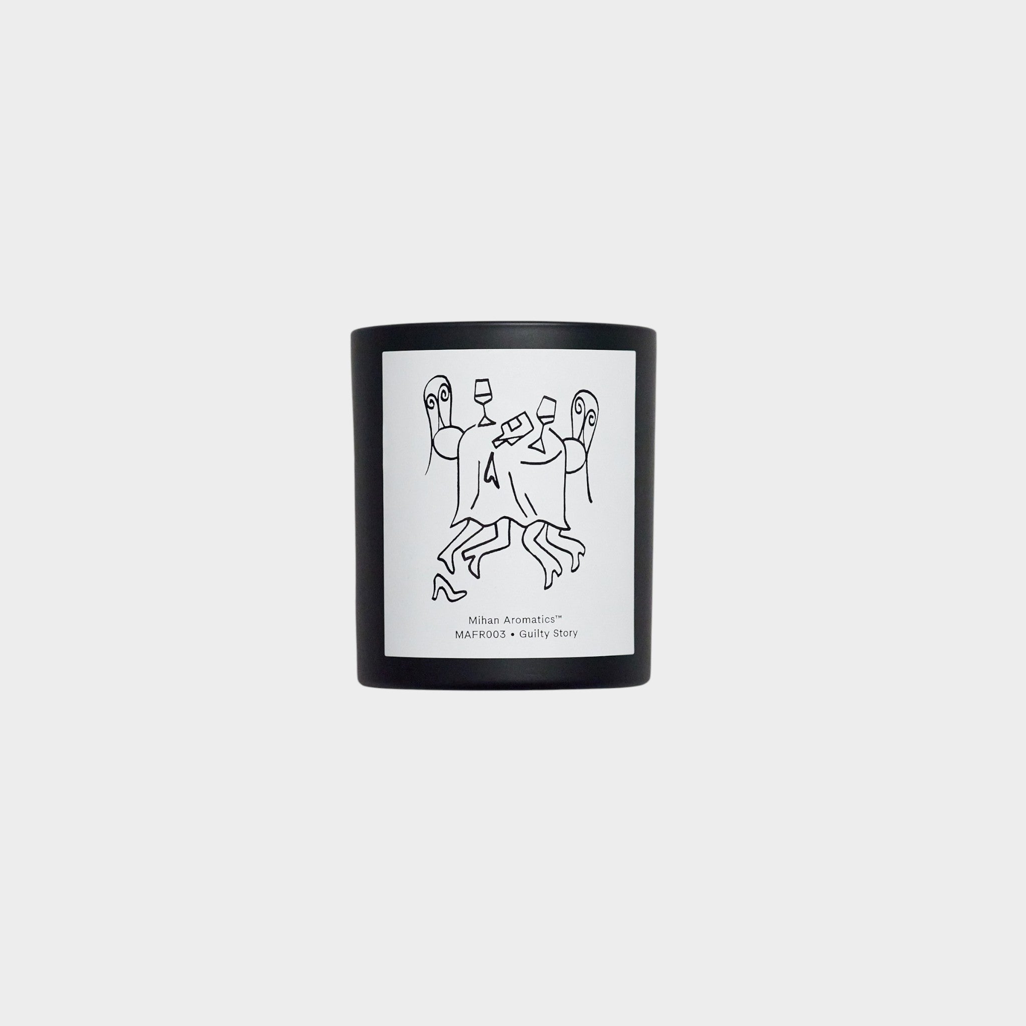 keep-collections Mihan Aromatics Guilty Story scented candle in a matte black glass vessel with a line art label.