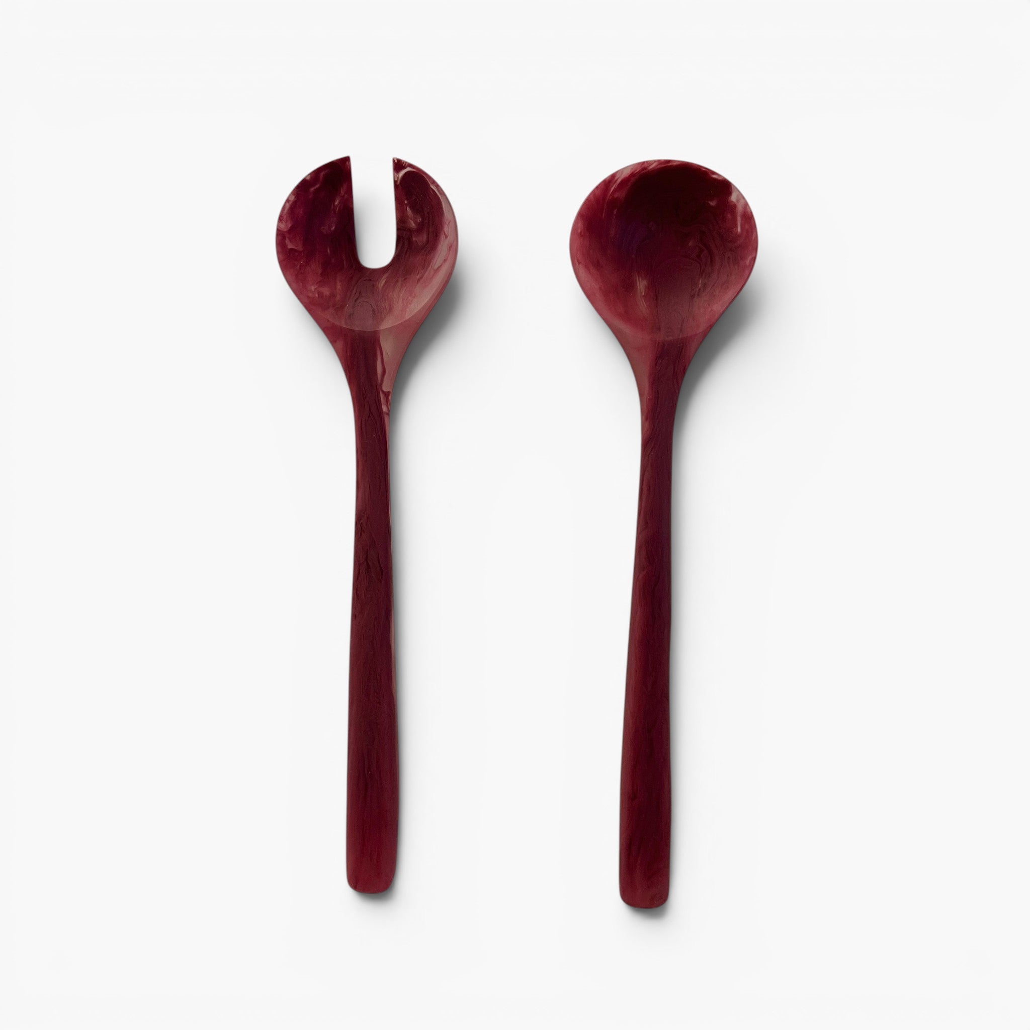 Keep Collections rhubarb resin salad servers, one with a fork head and one with a spoon head, handmade with unique marbled patterns.