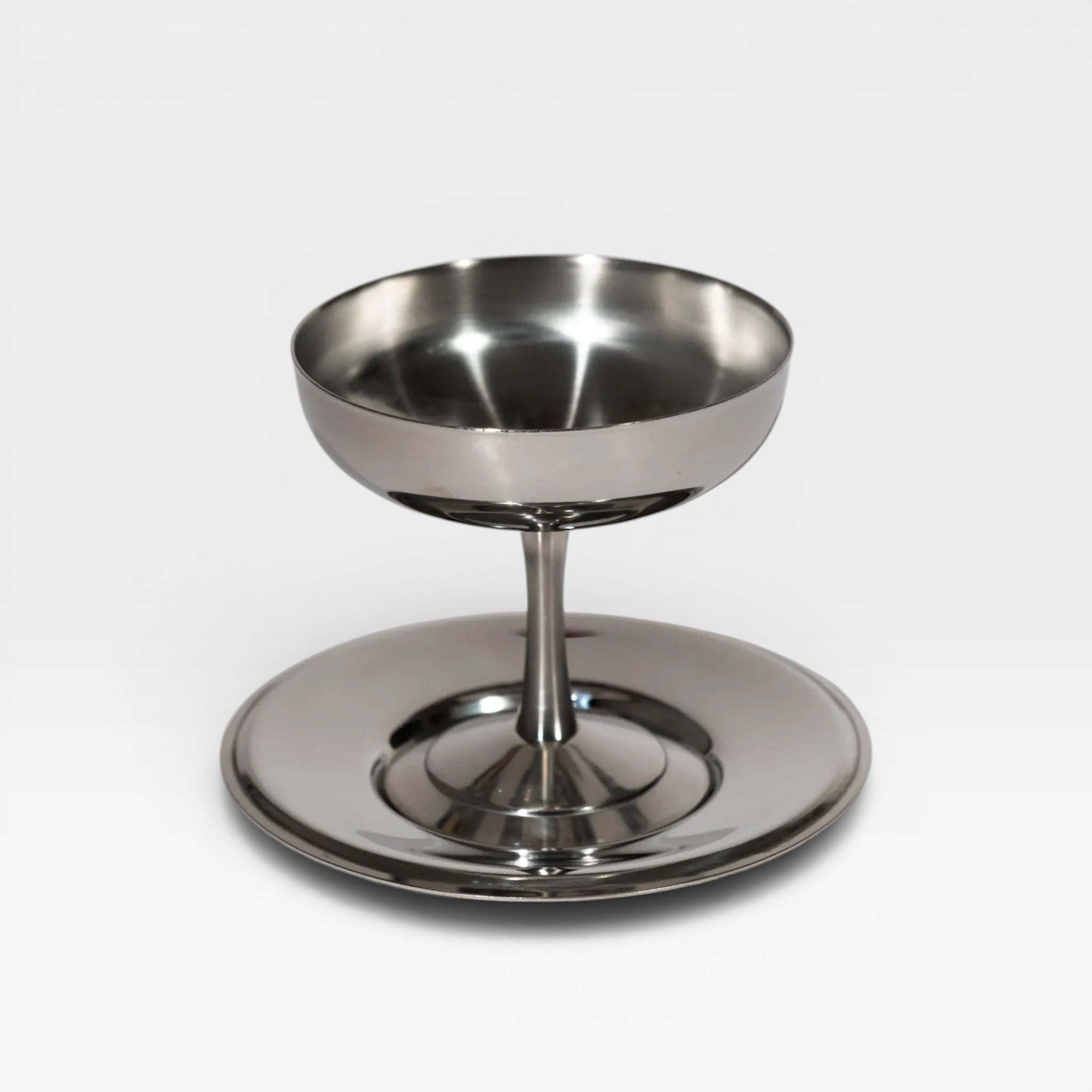 keep-collections stainless steel coupe glass with a polished finish and pedestal base on a white background